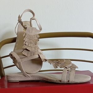 Jennifer Lopez Tan Sandals with Laser-Cut Design